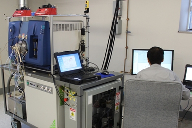 Ta-Hsuan Ong, technical lead on the development of this ultrasensitive vapor detection system, operates the equipment during its first field deployment at Hanscom Air Force Base.