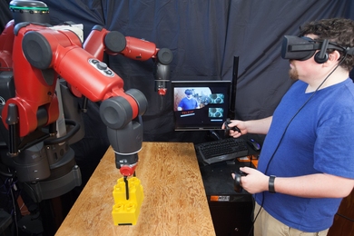 Consisting of a headset and hand controllers, CSAIL's new VR system enables users to teleoperate a robot using an Oculus Rift headset.