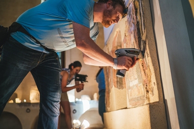 Assistant Professor Admir Masic uses an x-ray fluorescence spectrometer to analyze ancient materials in Italy. Masic is at the forefront of an “antiqua-inspired” approach to new materials, which considers how ancient successes can be leveraged for the creation of new, sustainable materials. 