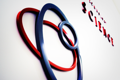 Red and blue circles that are part of a logo