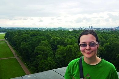 Carissa Skye a third-year physics major who interned at Shell in Hamburg, Germany, poses at the top of the Hamburg Planetarium.