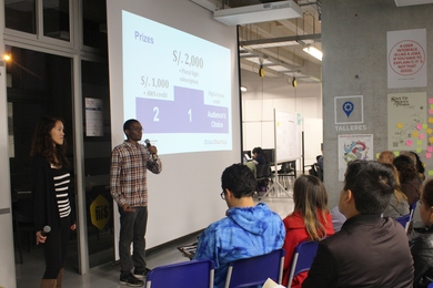 GSL-Peru students April Baker of MIT Sloan (left) and Dalitso Banda of EECS give a talk.