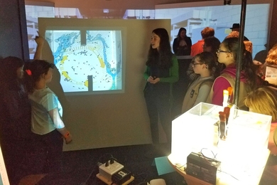 Graduate student Mara Freilich shows MIT Museum Girls Day attendees how plastics and debris become trapped in a gyre. 