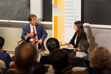 Bruno Verdini discusses strategies for natural resources negotiation with MIT Energy Initiative Communications Director Emily Dahl at a MITEI seminar.