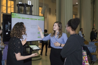 Seniors Alexa Jaeger (right) and Chelsea Chitty (center) present their capstone research project at the CEE Senior Celebration and Awards Night. 