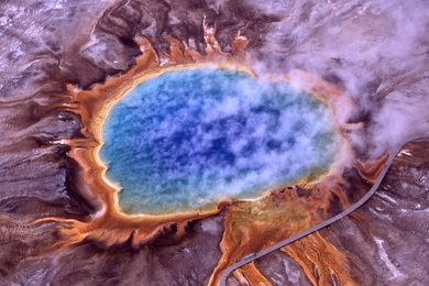Extremophiles are capable of living in some of the harshest locations on Earth, such as the Grand Prismatic Spring at Yellowstone National Park.