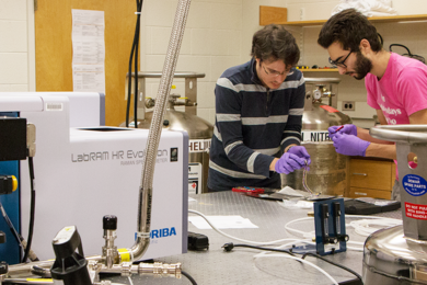 Riccardo Comin (left), an assistant professor of physics, and physics graduate student Abraham Levitan assemble the contacts on a sample holder that they’ll use to study the effects of high current on the superconducting material yttrium barium copper oxide, in the cryogenic optical spectrometer seen in the foreground. The setup enables the researchers to perform Raman spectroscopy down to 4 kel...