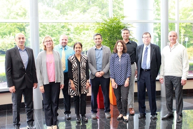 Members of the Health Analytics Collective: (left to right) Mohamad Zahreddine, Michelle Gayari, Duane Robinson, Uma Sharma, Vijay Ivaturi, Kelly Hill, Joga Gobburu, Alan Edelman, and Prasad Koppolu, gather at MMS Holdings in Canton, Michigan.   