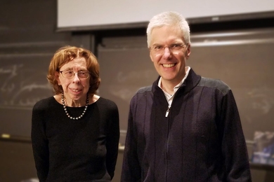 Audrey Buyrn (left) congratulates Raffaele Ferrari on his MIT School of Science Ally of Nature Fund Award.
