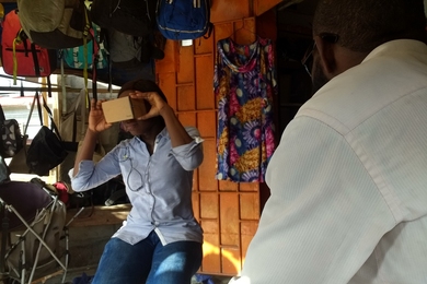 A survey team led by grad student Andrew Miller displays use of the virtual reality equipment, which helped elicit feedback on providing information about crimes in Lagos, Nigeria.