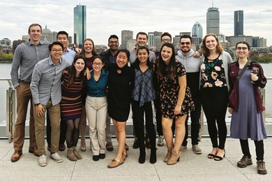 The CEE Class of 2019 gathered at MIT's Samberg Conference Center for a photo with the Boston skyline as the backdrop.