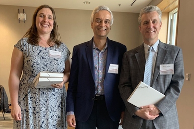 Dean of Digital Learning Krishna Rajagopal (center) with winners of the MITx Prize for Teaching and Learning in MOOCs, Jessica Sandland (left) and Martin Bazant. Not pictured: Polina Anikeeva, who also received the MITx Prize, and John Belcher, Amy Carleton, Jared Curhan, and Erik Demaine, who received Teaching with Digital Technology Awards.