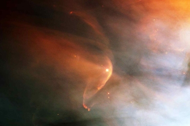 An example of an interstellar collisionless shock is seen in this photo of a bow shock in the Orion Nebula.