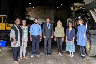 The Malden Works team gathered in the Malden, Massachusetts, Department of Public Works garage during a recent site tour: (left to right) Marcia Manong, Karen Buck, Evan Spetrini, Gary Christenson, Amber Christoffersen, Kathleen Vandiver, and Marie Law Adams.