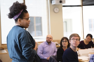 MIT Department Support Project Graduate Community Fellow Raspberry Simpson (left) addresses graduate students from many departments to discuss how to use data to better understand the graduate experience.