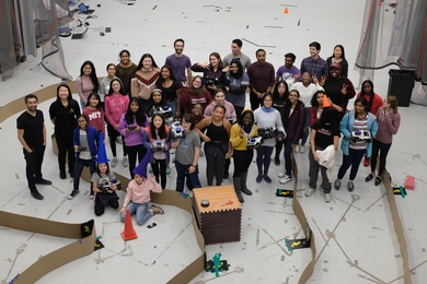 Middle school and high school girls meet in MIT's Building 31 to showcase the capabilities of the autonomous cars their teams programmed to navigate a circuitous course. 