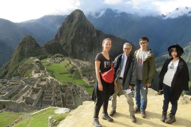 Left to right: The Machu Picchu Design Heritage project is a past Global Seed Fund recipient. Paloma Gonzalez, Takehiko Nagakura, Chang Liu, and Wenzhe Peng pose with a panoramic view of Machu Picchu in Peru. They are part of an MIT team that has worked to digitally document the site.
