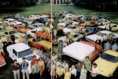 Participants of the Clean Air Car Race stand in front of their cars in Killian Court