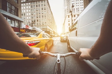 Photo of tight traffic in midtown Manhattan seen from a bicyclist's point of view.