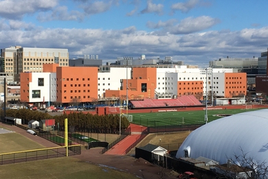 Photo of the exterior of W46, whose facade features alternating blocks of peach-colored and white brick