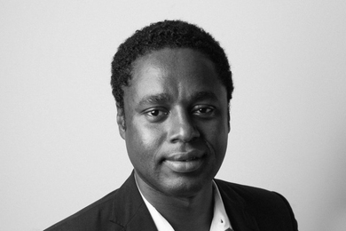 A black-and-white portrait photo of Claude Grunitzky 