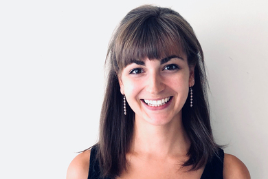 Portrait photo of Sophie Gibert against a white wall