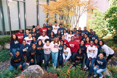 MIT Sloan Black Business Student Association group photo wearing MIT sweatshirts.