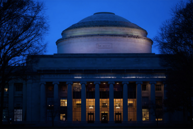 An image at night of the Great Dome on the MIT campus