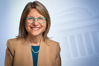 Portrait photo of Sally Kornbluth with faint black-and-white image of MIT's Great Dome in the background