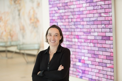 Photo of Angelika Amon standing with her arms crossed