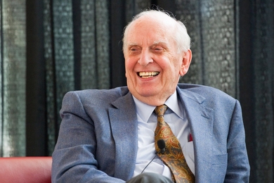 Headshot of William Pounds, seated and laughing