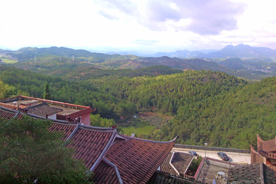 view of rooftops and landscape in China