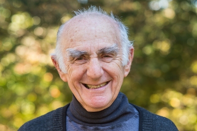 Portrait photo of Lee Grodzins, later in life, with trees in the background
