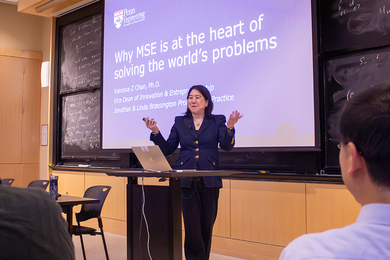 Vanessa Chan presents in front of a lectern at MIT.