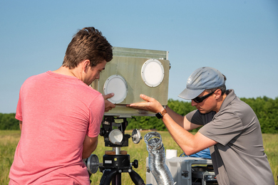 Ryan Walton and Ryan Lewis set up a radar and communications system for testing outdoors.
