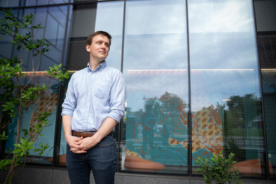 Nick Allen stands outside of MIT's Graduate Junction apartments.