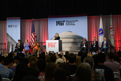 President Sally Kornbluth addressing an audience.