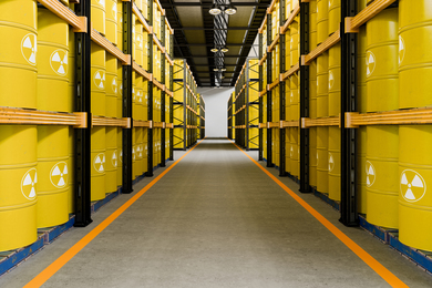Rows of nuclear waste barrels in storage
