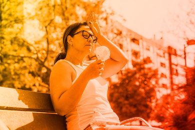 Overheated person with fan