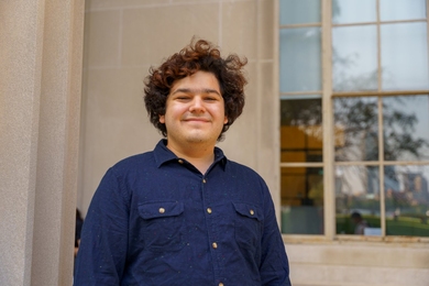 Diego Temkin poses next to an MIT building