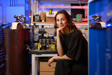 Audrey Parker seated in lab with blue lighting.